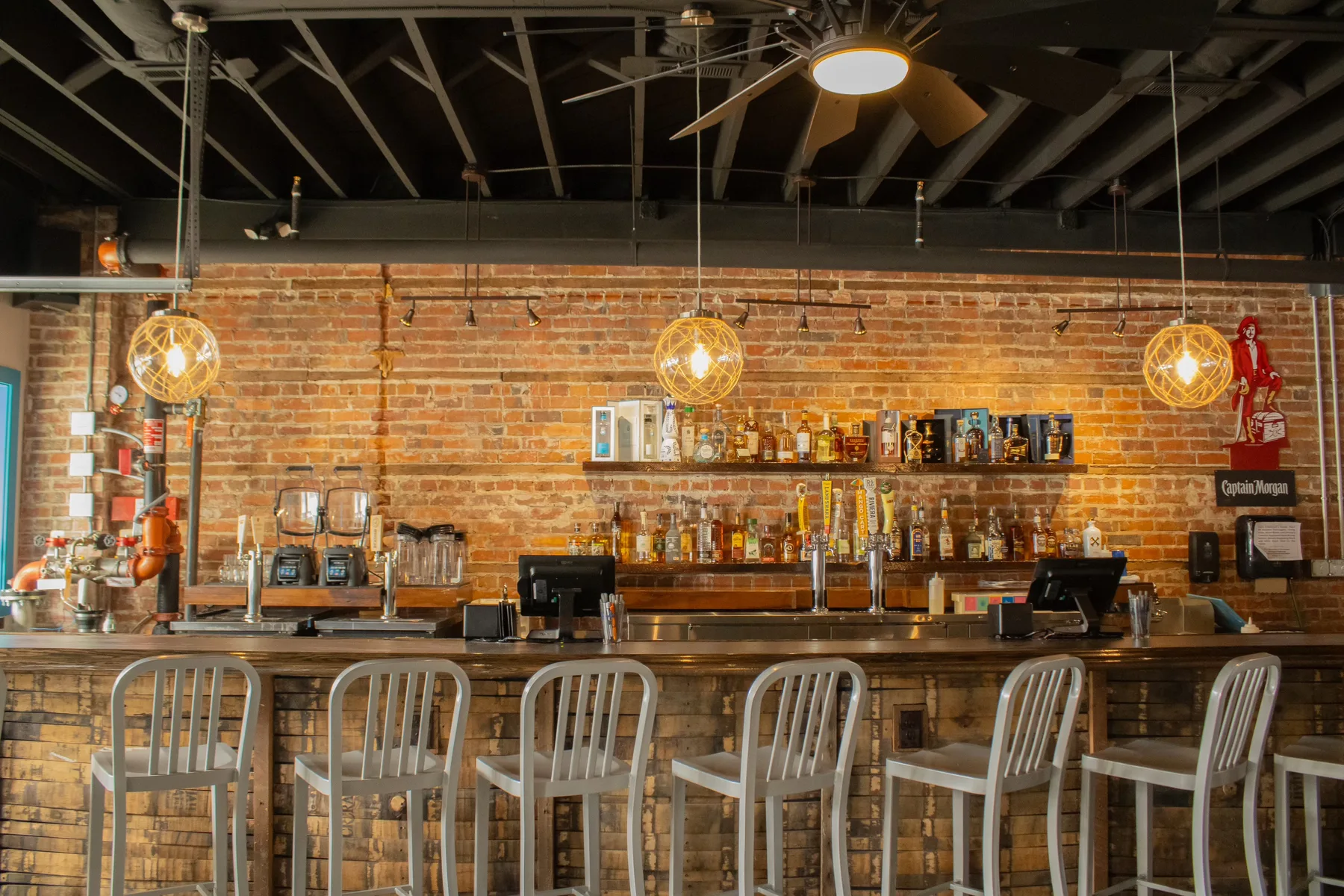Our bar interior with bottles displayed on the brick back bar