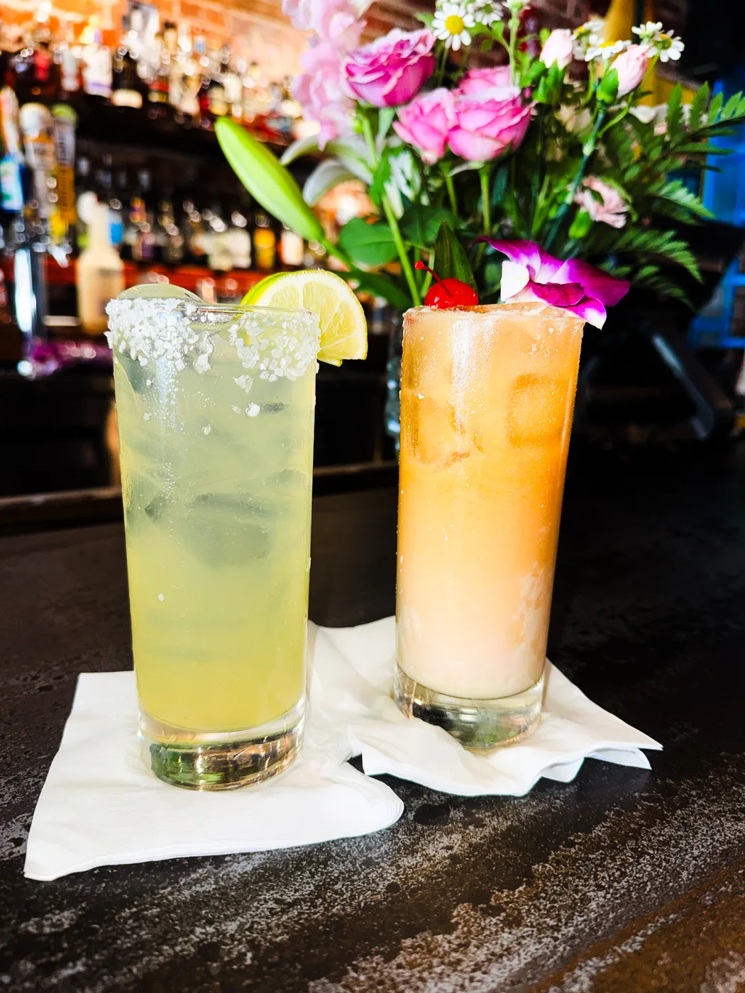 Two colorful tropical cocktails served at Royal James